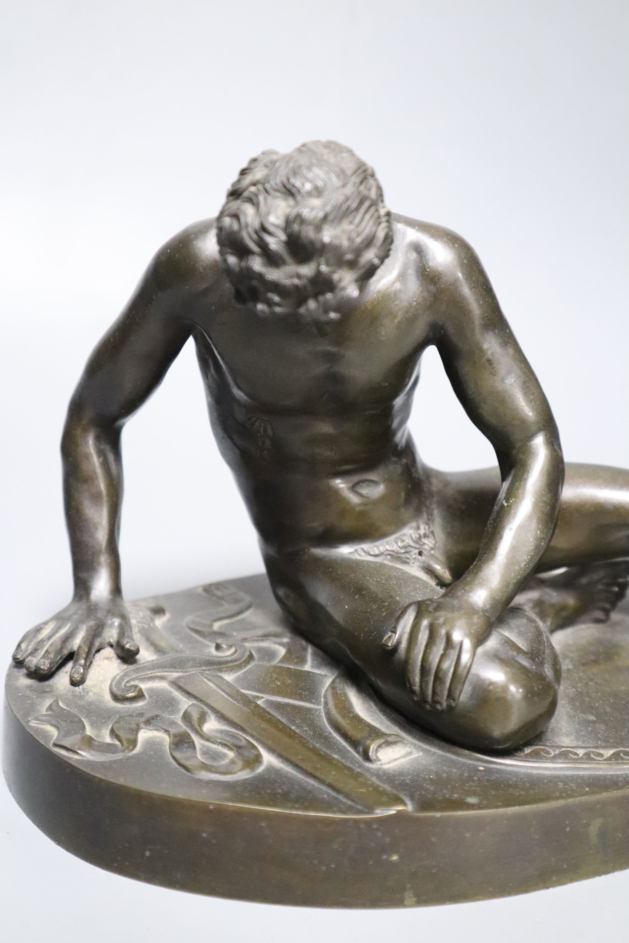 After the Antique. A 19th century bronze figure of the Dying Gaul, length 28cm